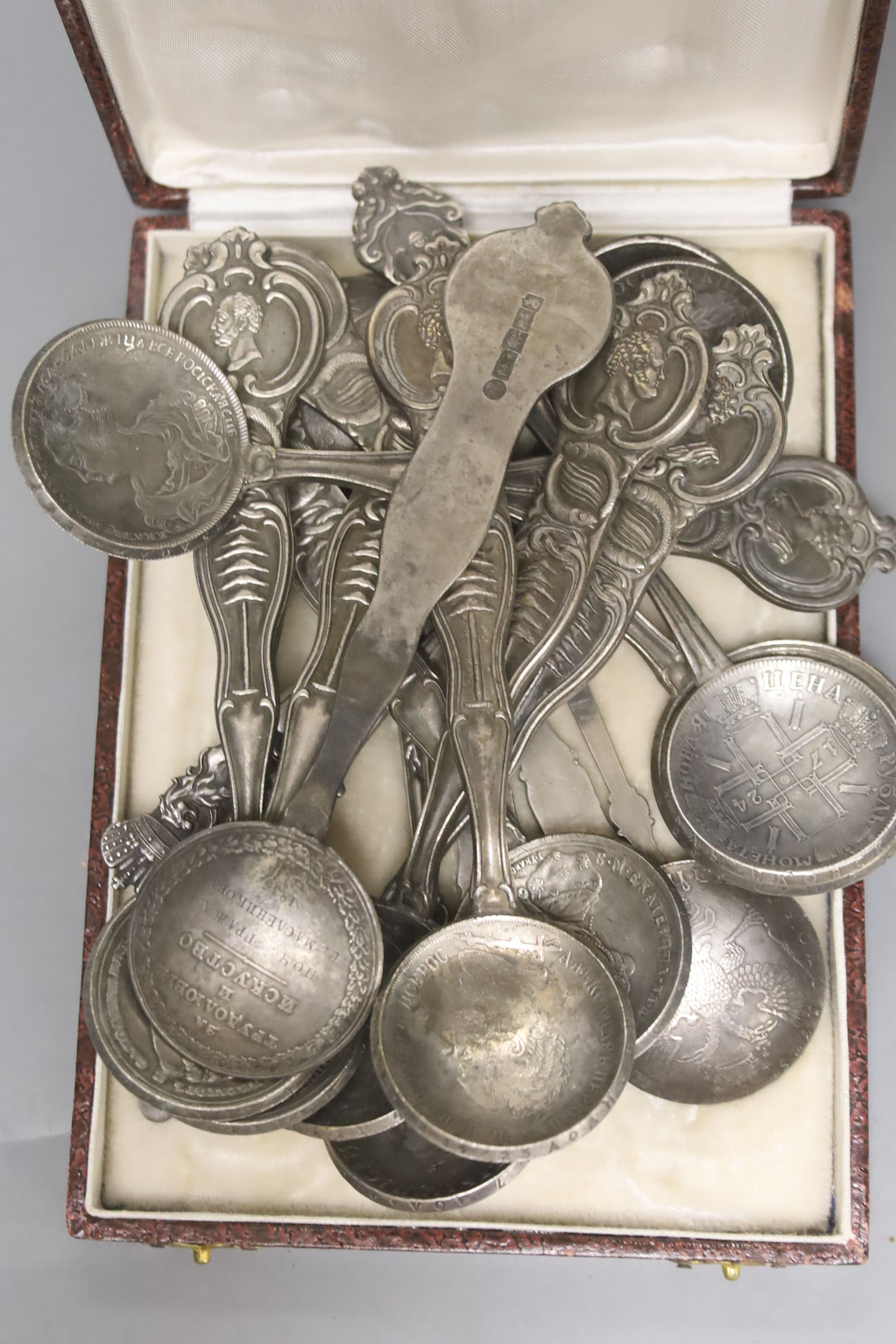 A quantity of plated tableware and cutlery